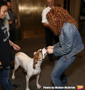 Bernadette Peters with a dog from The Humane Society of New York Photo