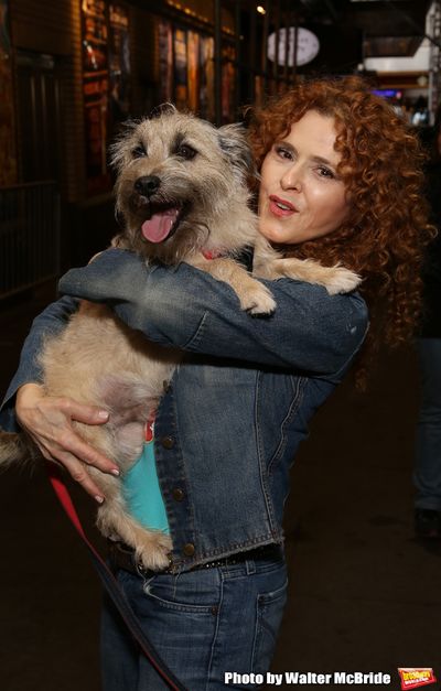 Bernadette Peters with a dog from The Humane Society of New York Photo