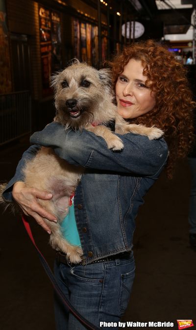Bernadette Peters with a dog from The Humane Society of New York Photo