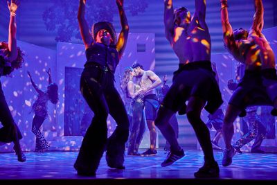 Lucy May Barker, Cameron Burt, and the cast of MAMMA MIA! Photo