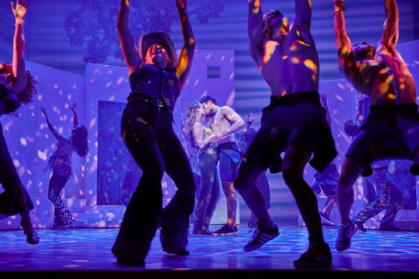 Lucy May Barker, Cameron Burt, and the cast of MAMMA MIA! Photo