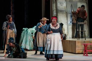 Judith Skinner as Queenie and members of the ensemble in The Glimmerglass Festival’s 2019 production of "Show Boat." Photo Credit: Connor Lange/The Glimmerglass Festival @ BroadwayWorld Judith Skinner as Queenie and members of the ensemble in The Glimmerglass Festival⿠Photo