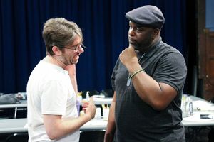 Playwright Dan McCabe and J. Bernard Calloway (Mr. Bugz) discuss the play. Photo
