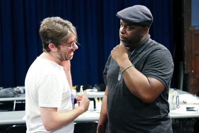 Playwright Dan McCabe and J. Bernard Calloway (Mr. Bugz) discuss the play. Photo