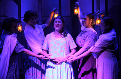 Ashton Botts as Alice Murphy with female ensemble  Photo