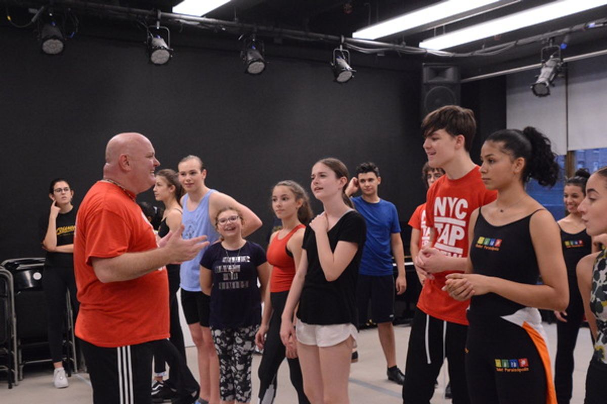 Thommie Retter instructs the dancers at 