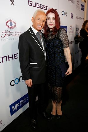 Elliot Mintz and Priscilla Presley  Photo