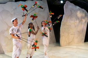 (from left) Micah Figueroa, Leslie Ann Sheppard and Lara Carling wield a swarm of fir Photo