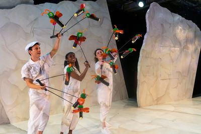 (from left) Micah Figueroa, Leslie Ann Sheppard and Lara Carling wield a swarm of fir Photo