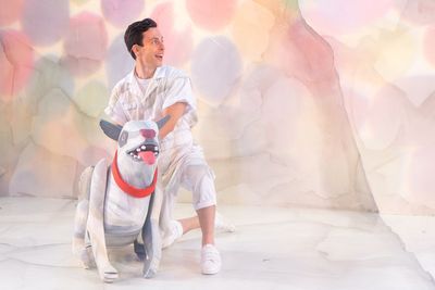 Micah Figueroa with White Dog from â€œBrown Bear, Brown Bear, What Do You See?,â Photo