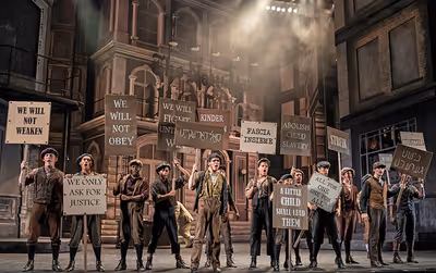 Newsboys go on strike to show a greedy publishing tycoon theyâ€™re not going to  Photo