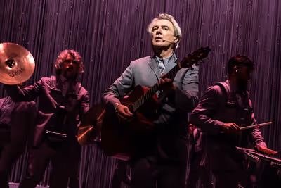 Mauro Refosco, David Byrne (center), and Gustavo Di Dalva Photo