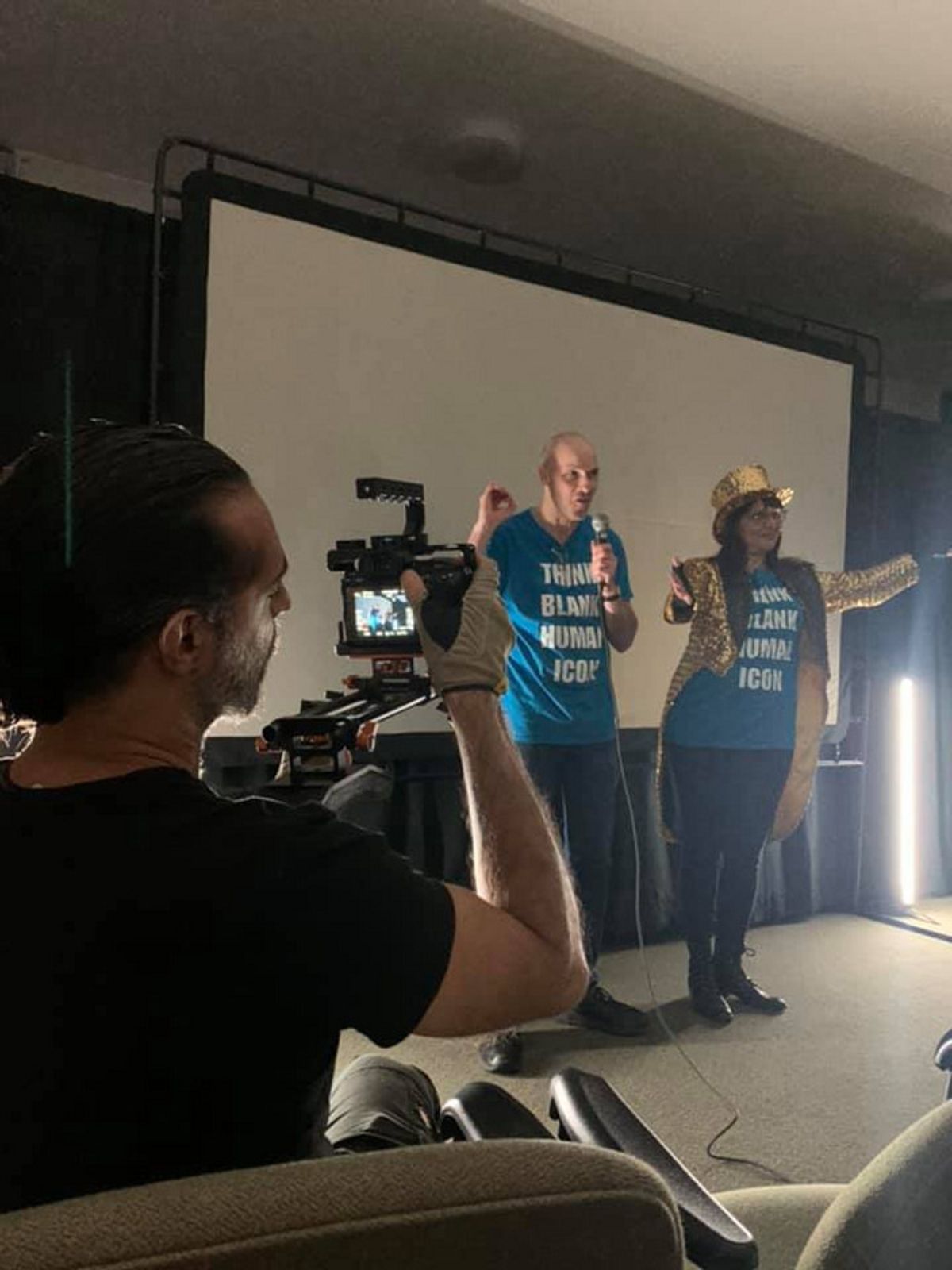 Co-creators Scott White and Lisa Anita Wegner prepare the audience for the opening night of Intangible Adorations. at 