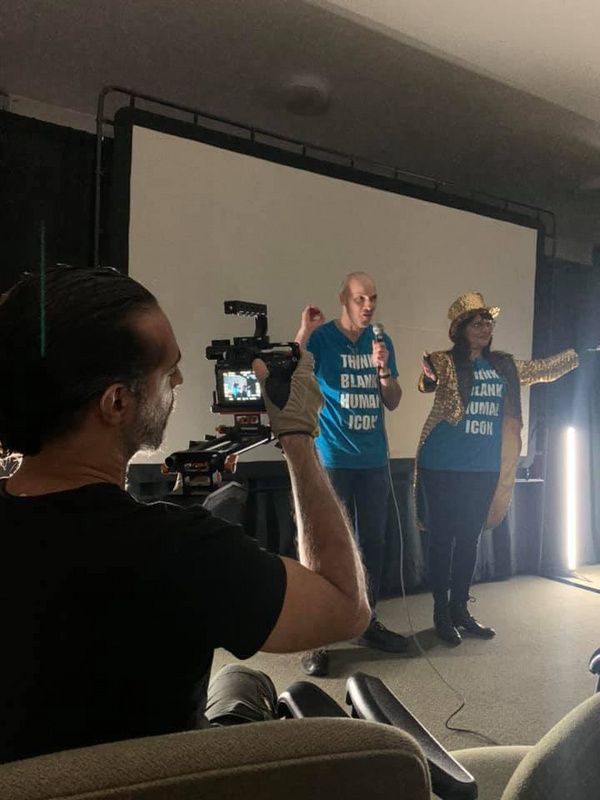 Co-creators Scott White and Lisa Anita Wegner prepare the audience for the opening ni Photo