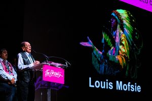 Center: Louis Mofsie accepting his 2019 Bessie for Outstanding Service to the Field of Dance which was presented by Kevin Tarrant, the lead singer of the intertribal drum and dance troupe SilverCloud @ BroadwayWorld Center: Louis Mofsie accepting his 2019 Bessie for Outstanding Service to the Field o Photo