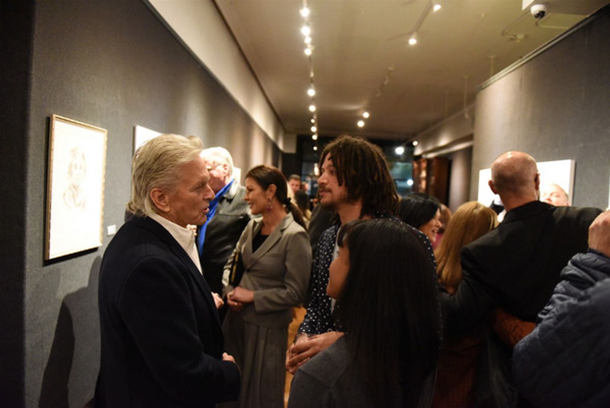 Michael Douglas and Taylor A. Purdee chat during Joseph Feury''s Fioretti: Through the Window exhibit at the Nation Arts Club. at 