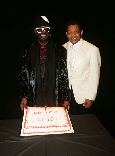  Otis Williams poses with Derrick Baskin Photo