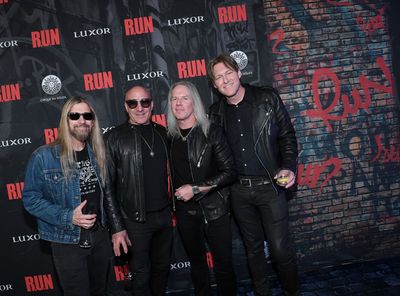 Bassist Stu Cook, drummer Kenny Aronoff, singer Robert Mason of Warrant and recording Photo
