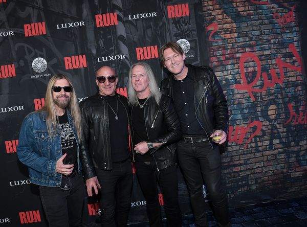 Bassist Stu Cook, drummer Kenny Aronoff, singer Robert Mason of Warrant and recording Photo