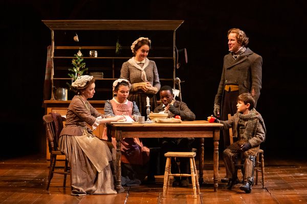 Elizabeth Bunch as Mrs. Cratchit, Chris Hutchinson as Bob Cratchit and Company Photo