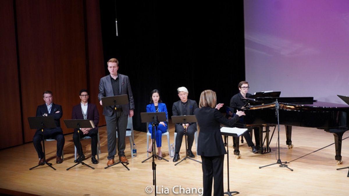Santa Fe Opera Chorus Master Susanne Sheston conducts the world premiere preview of M. BUTTERFLY, with (from left to right) tenor Joshua Dennis, bass Adrian Rosas, baritone Michael Hawk (standing), so at 