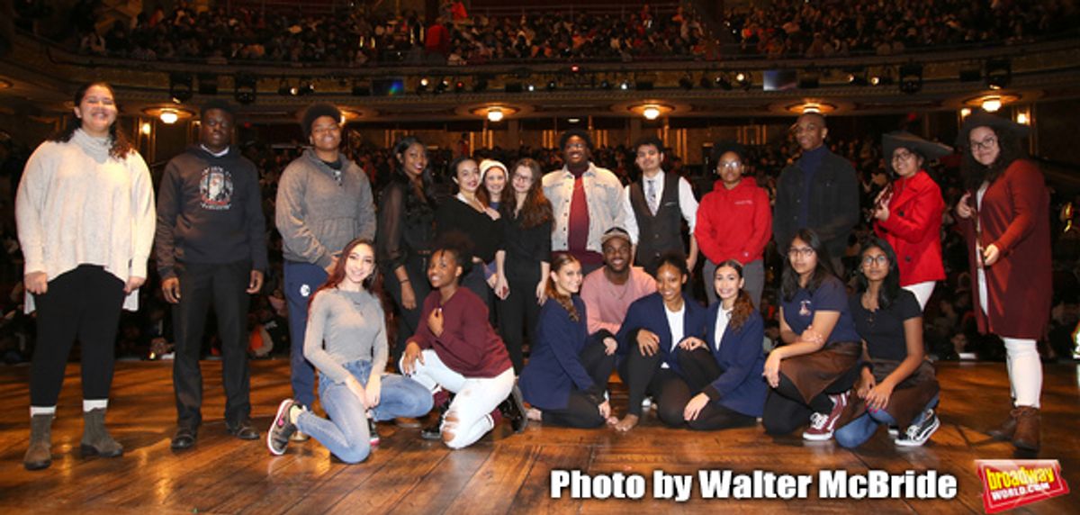 Deon'te Goodman with student performers at 