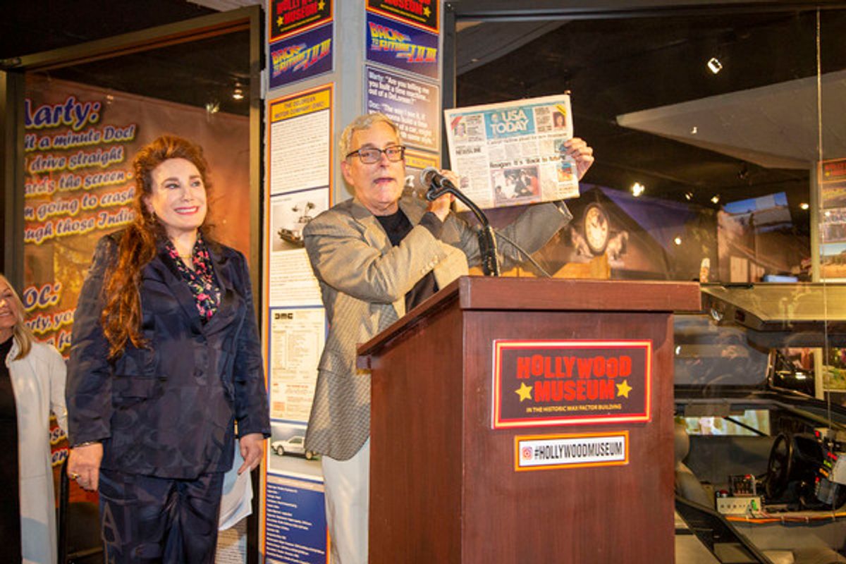 Museum President & Founder, Donelle Dadigan, and Back to the Future creator, Bob Gage at podium at 
