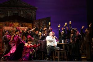 (center, seated) Adam Grupper as Alfred P. Doolittle and Company in The Lincoln Center Theater Production of Lerner & Loewe’s MY FAIR LADY
@ BroadwayWorld (center, seated) Adam Grupper as Alfred P. Doolittle and Company in The Lincoln Cente Photo