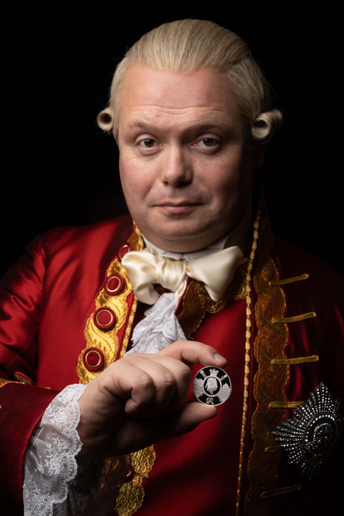 Gavin Spokes with The Royal Mint’s new £5 commemorative coin  at 