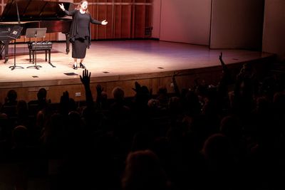 Series host, soprano Allison Charney, engaging the PREformances audience in her signa Photo