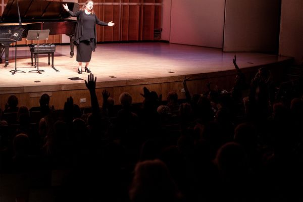 Series host, soprano Allison Charney, engaging the PREformances audience in her signa Photo