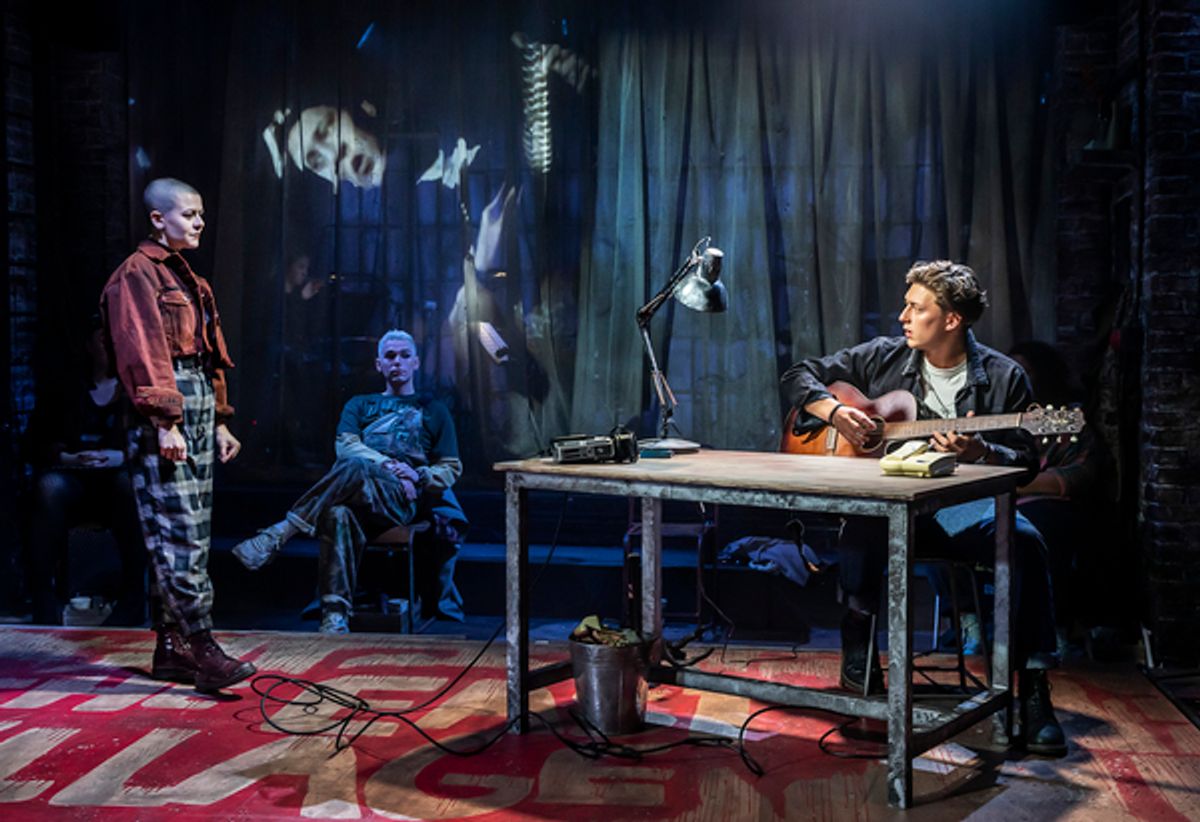 Tom Francis (Roger) Bethany Terry (Featured Ensemble) and Isaac Hesketh (Featured Ensemble) in RENT at Hope Mill Theatre. Photographer Pamela Raith.jpg at 