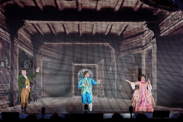 Lucas Meachem as Figaro, Alek Shrader as Count Almaviva, and Daniela Mack  Photo