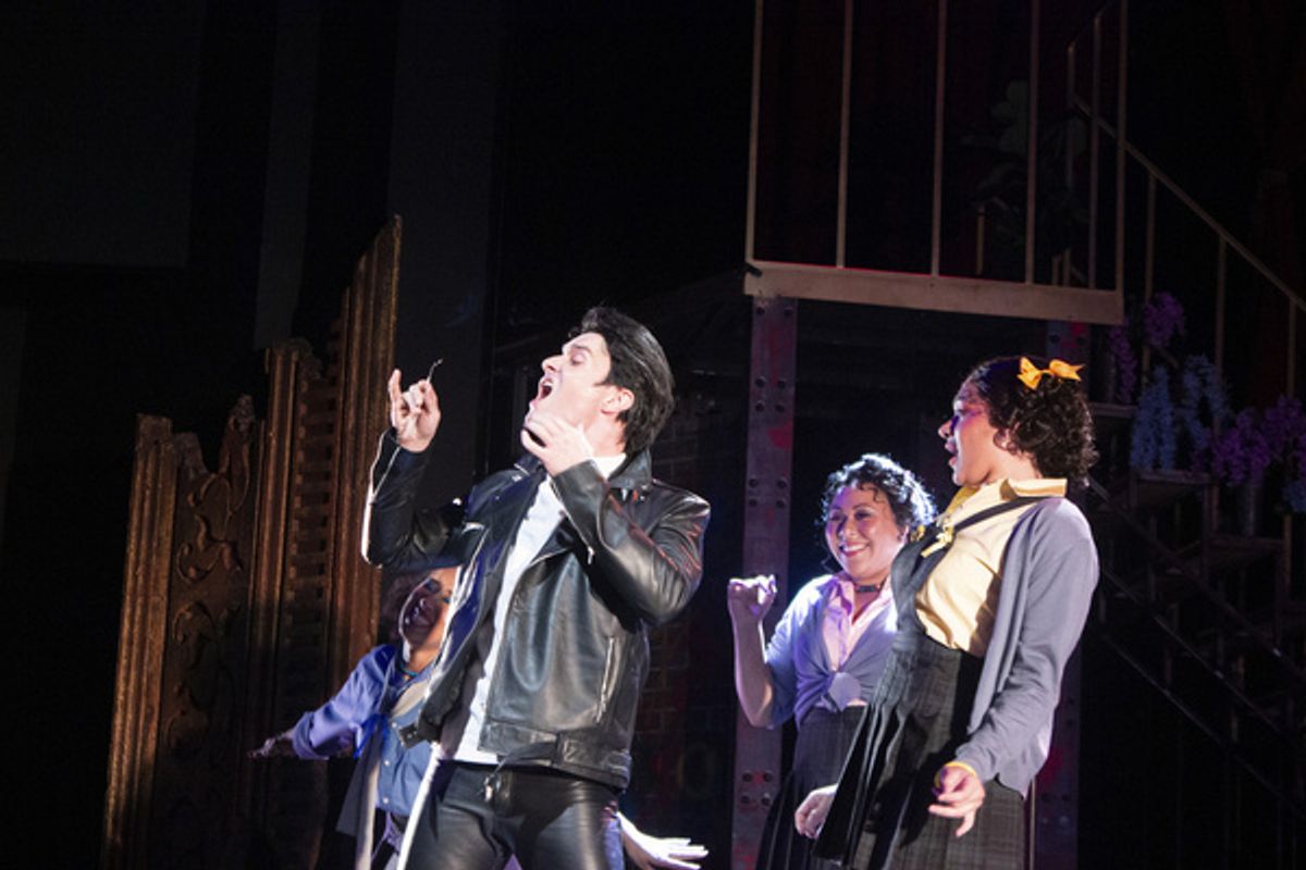 Orin (Jamie Michael Parnell) admires himself as the Urchins (Blair Beasley, Jazmin Moehring) look on in the Arizona Broadway Theatre production of Little Shop of Horrors.jpg at 