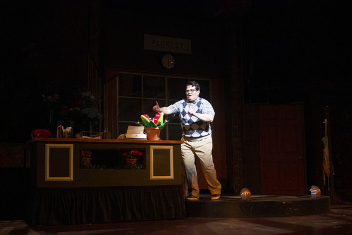 Seymour (Isaac Wesley Wilson) makes a discovery in the Arizona Broadway Theatre production of Little Shop of Horrors at 