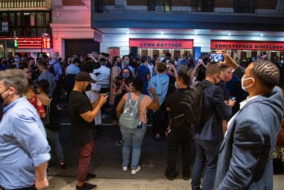Audience members attend the block party celebrating PASS OVER Photo