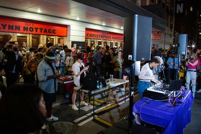 Audience members attend the block party celebrating PASS OVER Photo