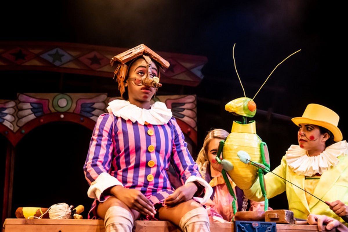 Cassandra Hercules as Pinocchio and Serin Ibrahim as Grillo in Pinocchio at Greenwich Theatre at 