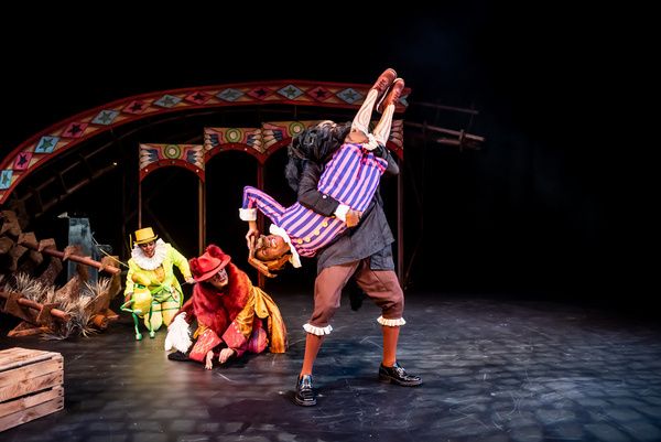 Serin Ibrahim as Grillo, Adam Karim as Volpino, Cassandra Hercules as Pinocchio and R Photo