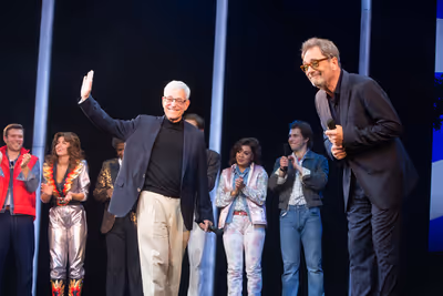 Bob Gale and Huey Lewis with the company Photo
