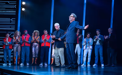 Bob Gale and Huey Lewis with the company Photo