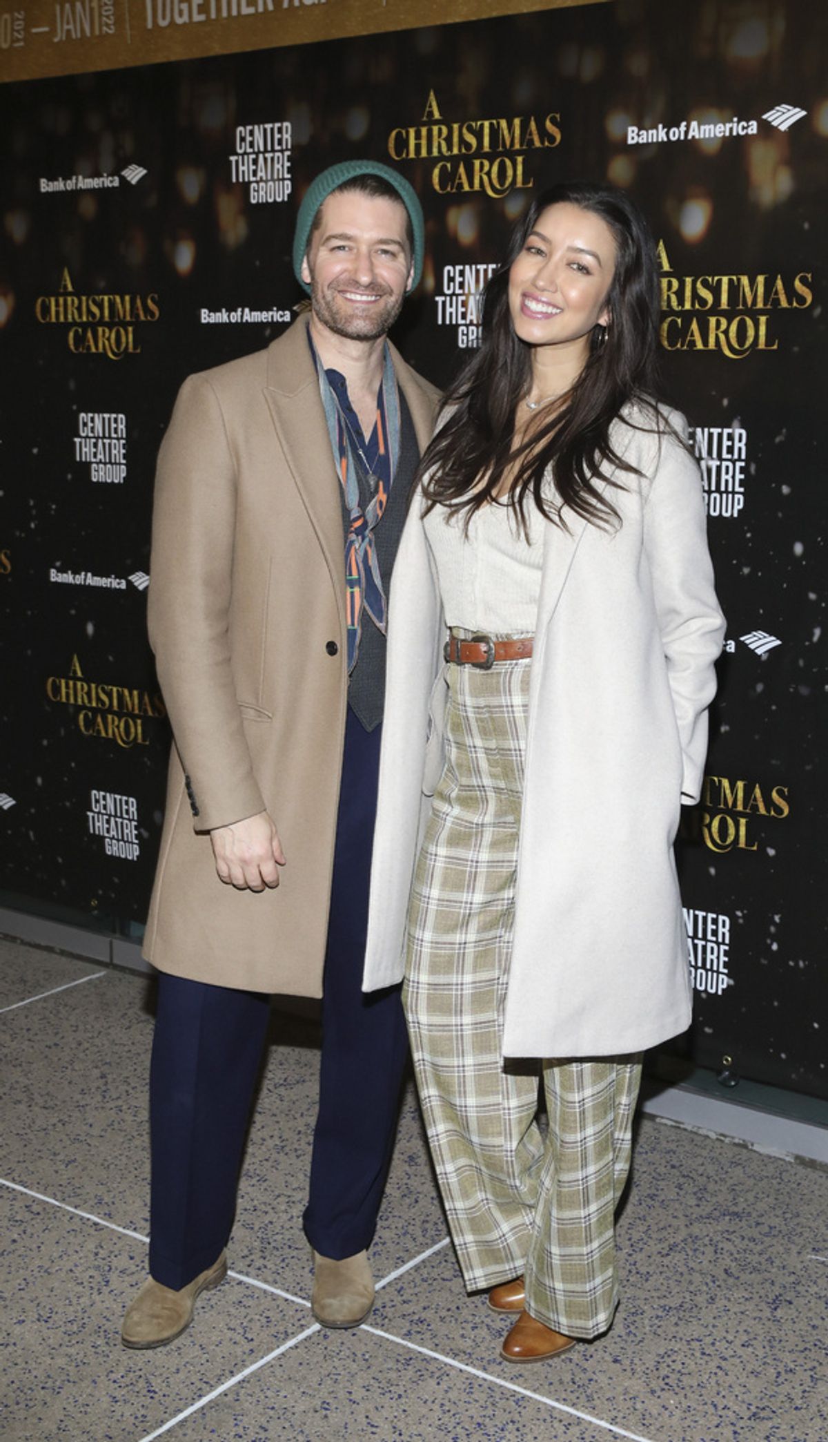 From left, Matthew Morrison and Renee Puente arrive for the opening night performance of ?A Christmas Carol? at Center Theatre Group/Ahmanson Theatre on Dec. 1, 2021, in Los Angeles, California. (Phot at 