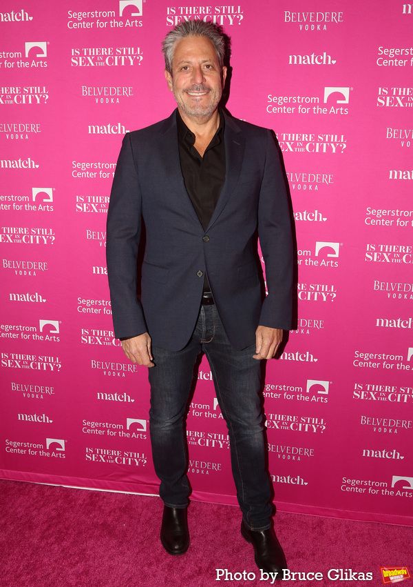 Darren Star poses at the opening night of the new Candace Bushnell one-woman show 