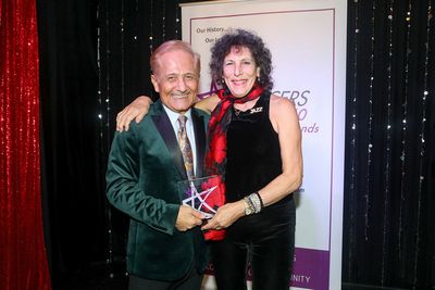 John Sefakis presenting to Sue Samuels Photo