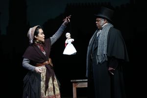 Justine “Icy” Moral as Doll Vendor and Craig Wallace as Ebenezer Scrooge @ BroadwayWorld Justine “Icy” Moral as Doll Vendor and Craig Wallace as Ebenezer Scrooge Photo