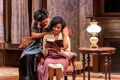 Annelle (Ayanna Bria Bakari, left) tries to tempt her sister Janet (Jaye Ladymore) in Photo
