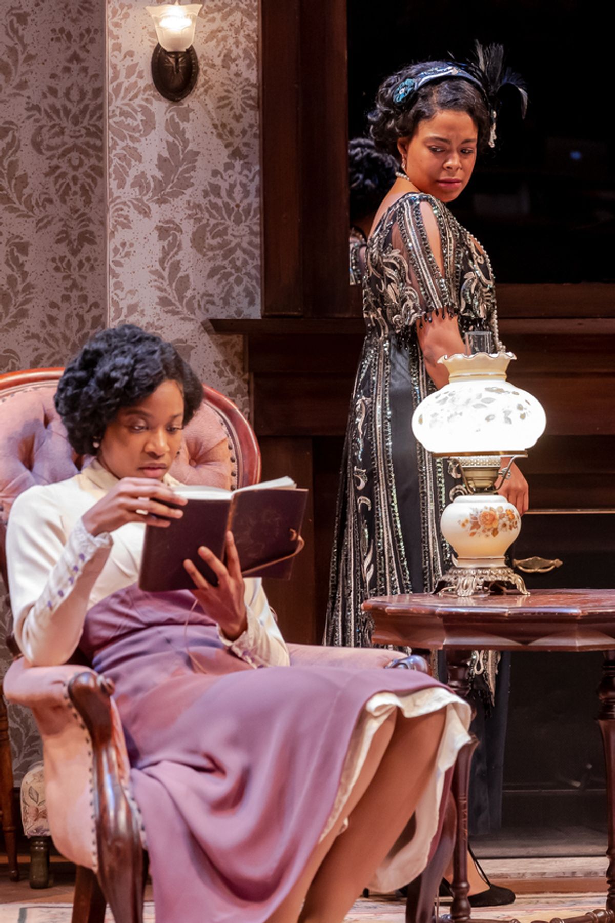 Sisters Annelle (Ayanna Bria Bakari, left) and Janet (Jaye Ladymore) have differing opinions about what to do with the diaries left by their mother. at 