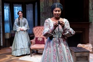 Zhuukee (also called Annabelle Lee) (Demetra Dee, right) is touched by a gift from Mary Anna Elizabeth (Rebecca Hurd).
@ BroadwayWorld Zhuukee (also called Annabelle Lee) (Demetra Dee, right) is touched by a gift from Ma Photo