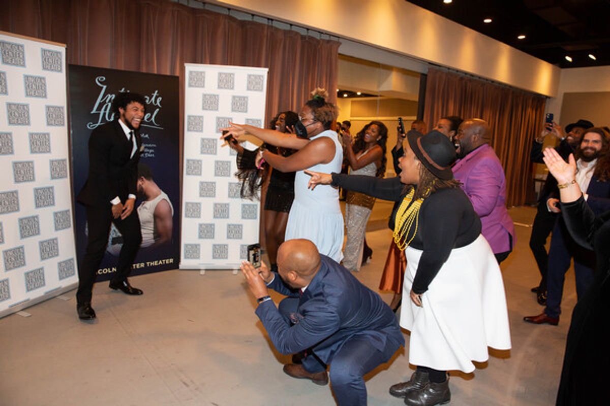 Justin Austin (center) with members of the cast and crew of INTIMATE APPAREL at 