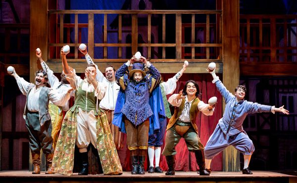 Justin Michael Wilcox (center) and the company of Something Rotten! Photo